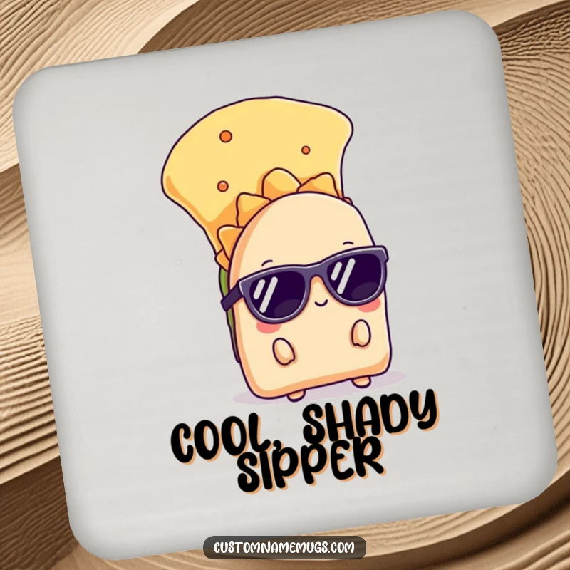 Funny drink coaster with a shy taco wearing sunglasses, peeking from behind a chip, offering cool and humorous surface protection.