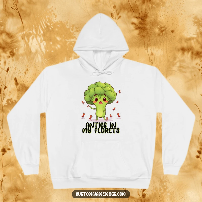 Funny hoodie with a surprised broccoli character juggling tiny dancing ants, offering cozy and comical style.