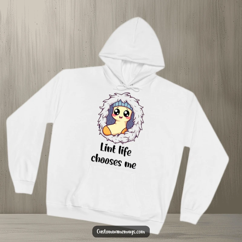 Funny Kawaii sock character with wide eyes caught by a fluffy dryer lint monster, a humorous hoodie for cold days and laundry.