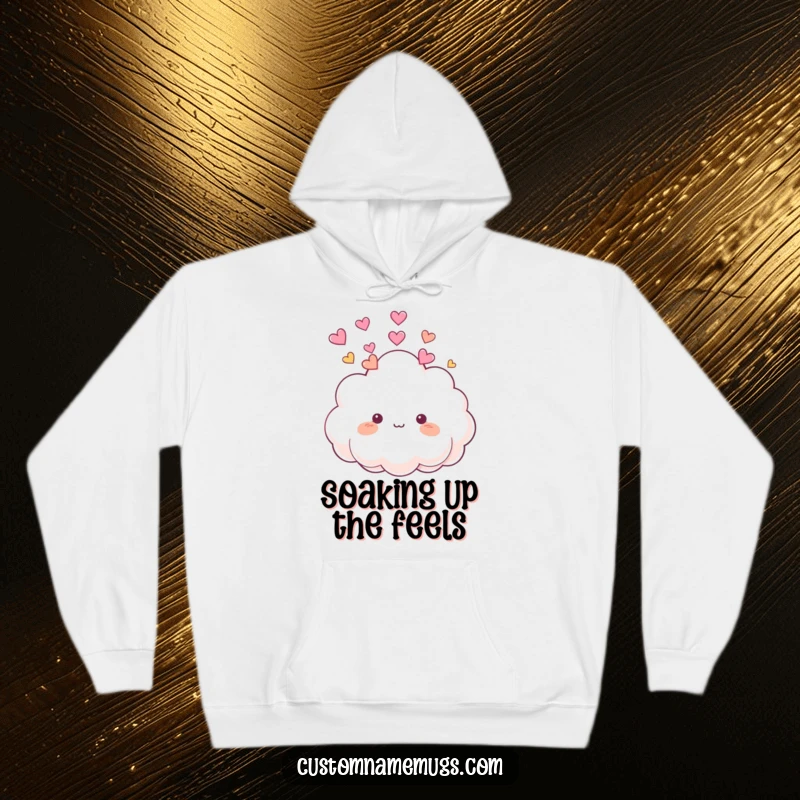 Funny Hoodie: Cute, fluffy cloud character happily raining small, colorful hearts onto its own head, feeling the love.