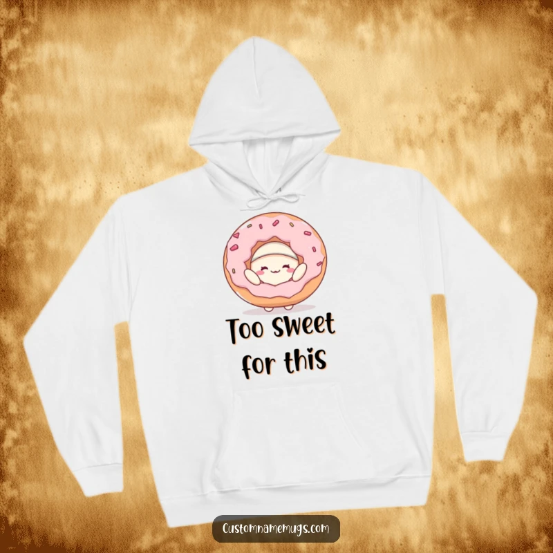 Funny hoodie depicting a joyful blob character humorously trying to wear a massive donut as a hat, perfect for cozy, comical relaxation.
