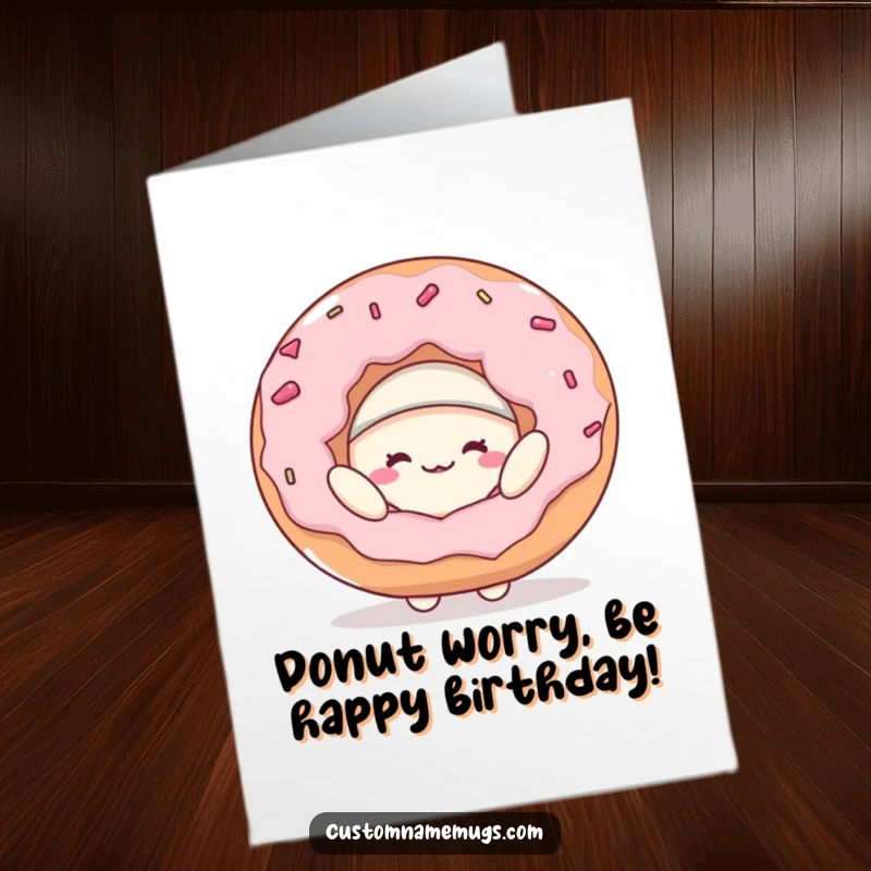 Funny Free Printable Birthday Card featuring a happy blob character struggling to wear a giant donut as a hat.