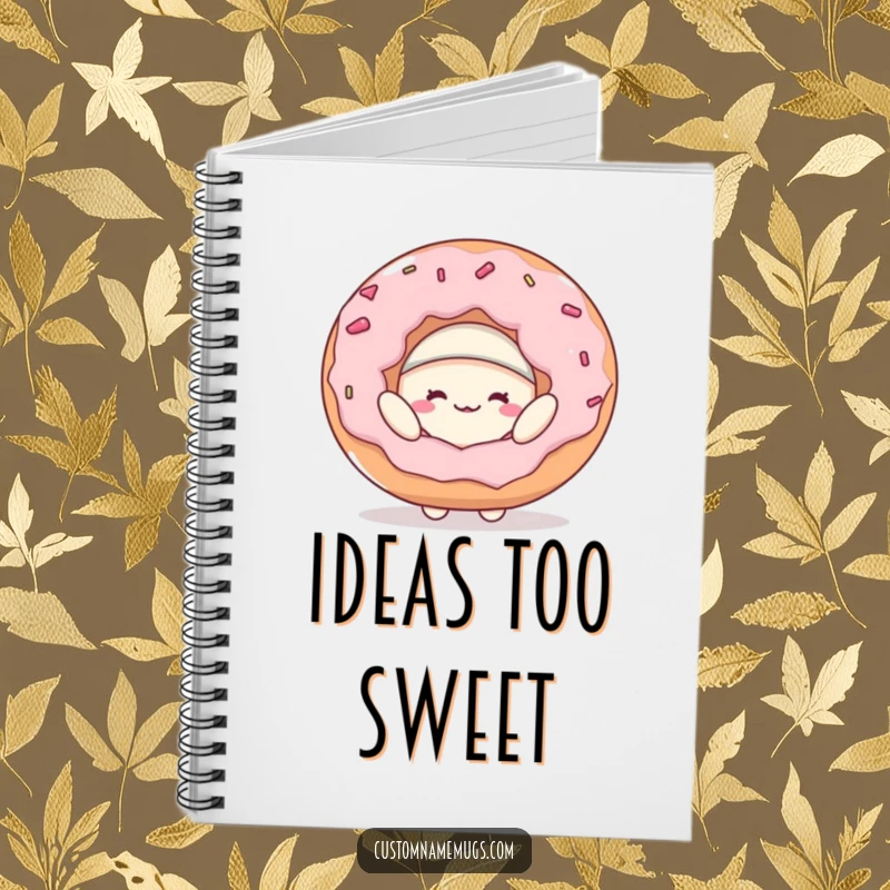 Funny notebook with a cover featuring a cheerful blob character trying on a huge donut as a hat, inspiring sweet and silly notes.