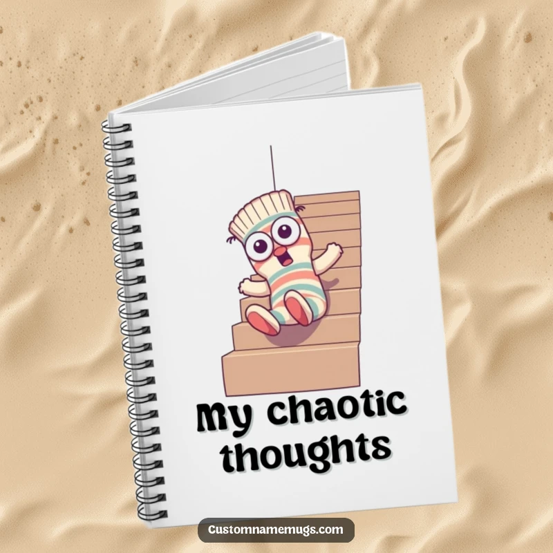 Funny notebook with a goofy sock character with mismatched eyes tumbling down stairs, inspiring humorous note-taking and chaotic creativity.
